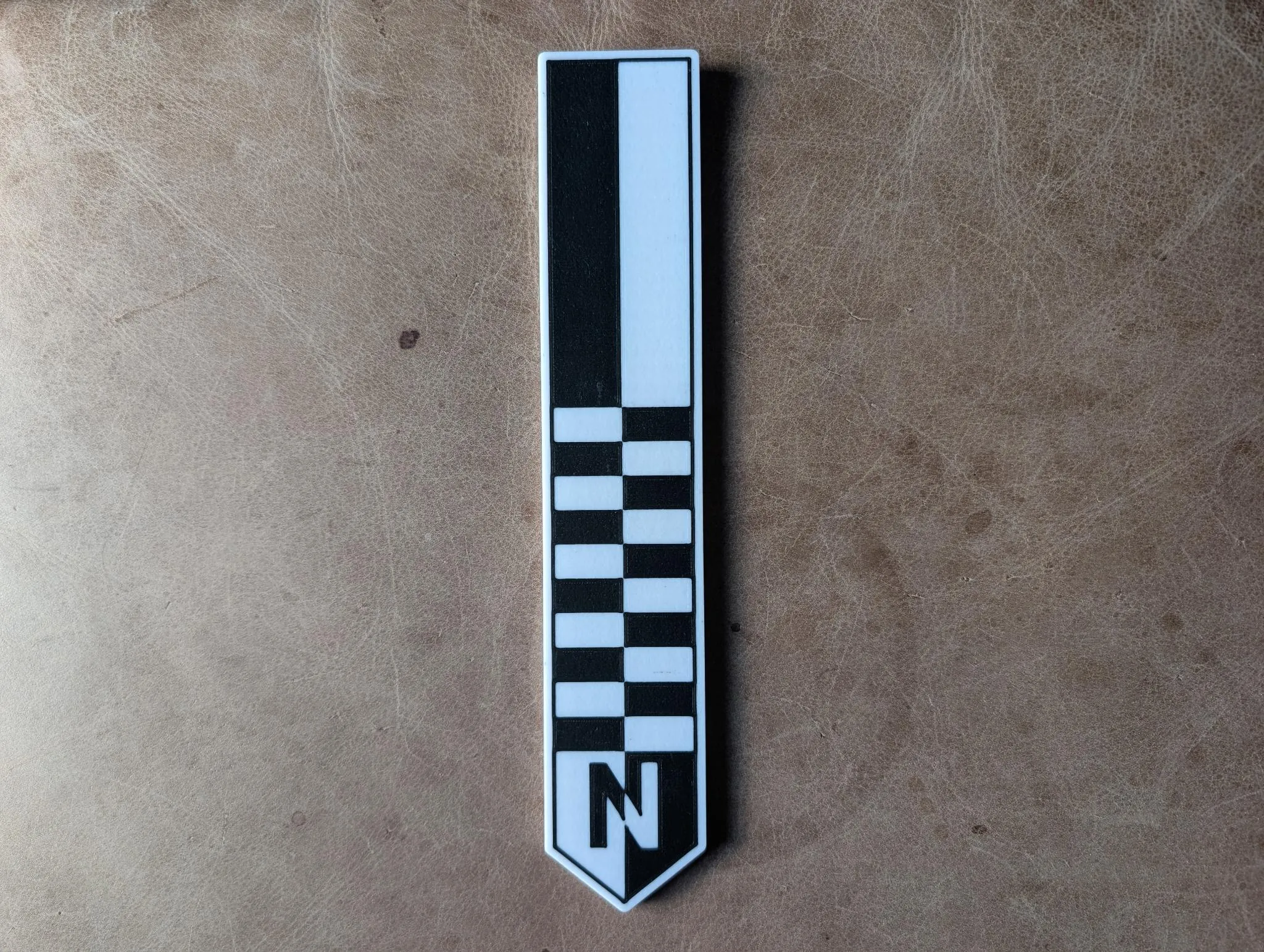 The north arrow shown from a second angle, showing the printed layer finish